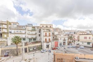 an aerial view of a city with buildings at Nova Suite in Calatafimi