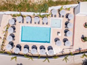 an overhead view of a resort with a swimming pool at Oros Paradise Hotel in Pastida