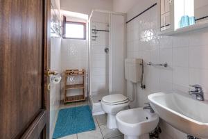 a bathroom with a toilet and a sink at Agriturismo Il Pescinone in Venturina Terme +89 photos