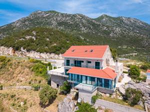 an aerial view of a house with an orange roof at Galeb Bed and Breakfast in Baćina