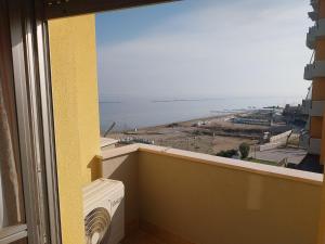 a view of the ocean from the balcony of a building at LaSpiaggia21 in Marotta