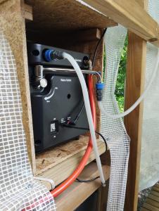 a camera in a wooden box with wires at La Ramie in Marat
