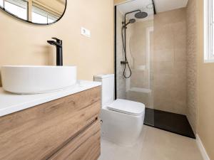 a bathroom with a toilet and a shower at Sanchis Studios in Alicante +57 photos