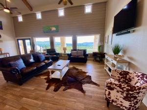 a living room with a couch and a table at Pretty Penny in Concan