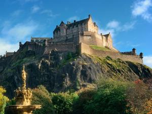 a castle perched on top of a mountain at The Easter Suites with free parking in Edinburgh