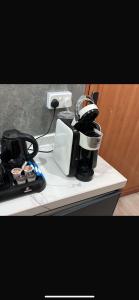 a coffee maker sitting on top of a counter at الجوهره حائل in Hail