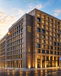 a novotel london building with the novotel logo on at Novotel Hamburg Central Station in Hamburg