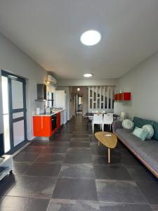 a living room with a couch and a table at Pebble Home in Yialós +32 photos