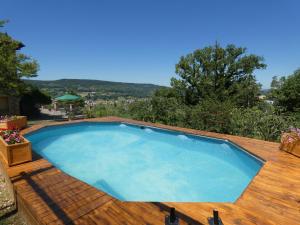 a large swimming pool on a wooden deck at Scappo in Umbria, L'antico casale in Narni +43 photos