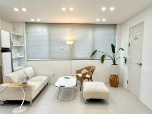 a living room with a couch and a table at Lagom villiage in Paegun-dong