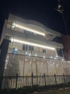 a building with lights on the side of it at night at Lagom villiage in Paegun-dong