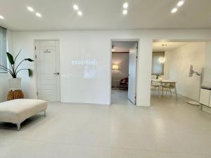 a white room with a door and a table at Lagom villiage in Paegun-dong +1 photo