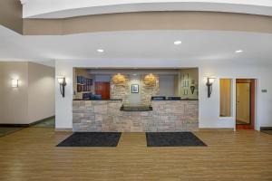 a lobby with a stone fireplace in a building at Best Western PLUS Fossil Country Inn & Suites in Kemmerer +62 photos