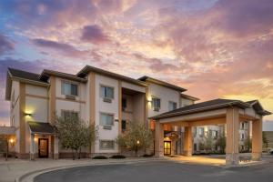 a rendering of a building with a sunset at Best Western PLUS Fossil Country Inn & Suites in Kemmerer