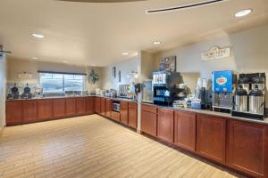 a lobby of a coffee shop with a counter at Best Western PLUS Fossil Country Inn & Suites in Kemmerer