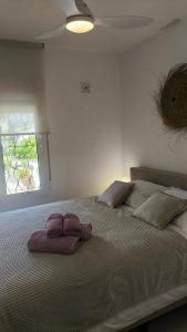 a bedroom with a large bed with two pillows on it at Casa Marie - Albir in Albir +97 photos