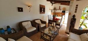 a living room with a couch and chairs and a table at Villa Mirella in Jávea