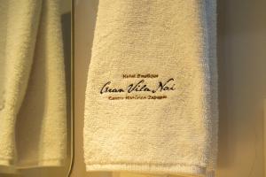 a towel with the words linen millefiore rest on it at Gran Vila Nai Boutique Hotel in Guadalajara
