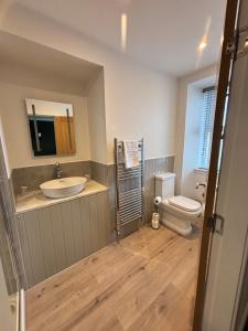 a bathroom with a sink and a toilet at Abbotshall in Fife +27 photos