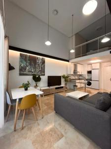 a living room with a couch and a table at CriteriaHome! nice&easy in Madrid