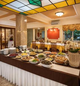 a buffet of food on a table in a restaurant at Hotel Mazzocca in Caramanico Terme