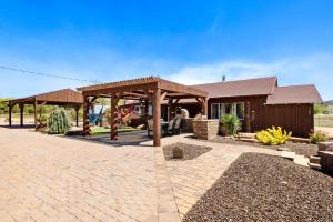 a pavilion with a playground in front of a house at Zebra Ranch 16-guest Compound Mtn Vuspapkl Bal in Prescott