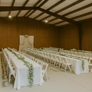 a row of tables and chairs in a banquet hall at Zebra Ranch 16-guest Compound Mtn Vuspapkl Bal in Prescott
