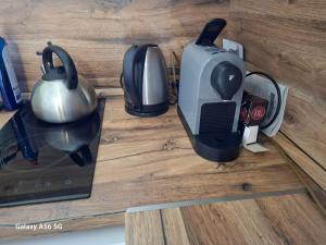 a toaster oven and a tea kettle on a counter at Ubytovanie u Aničky in Nová Sedlica