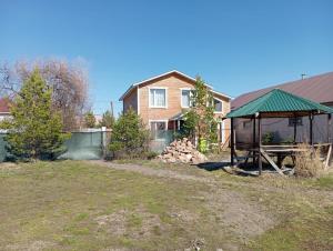 a house with a gazebo in a yard at Коттедж Бурабай улица Алатау 38 in Borovoye