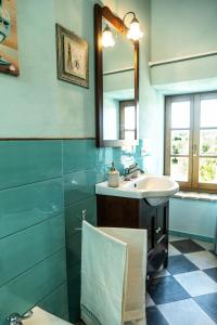 a bathroom with a sink and a mirror at La casa di Mariasole in SantʼElpidio a Mare +36 photos