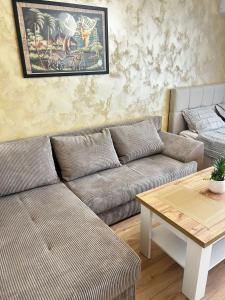 a living room with a couch and a table at Dream 3 in Sunny Beach