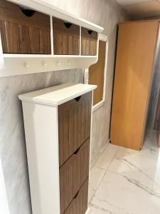 a kitchen with wooden cabinets and a counter top at Dream 3 in Sunny Beach