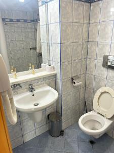 a bathroom with a toilet and a sink at Dream 3 in Sunny Beach +6 photos