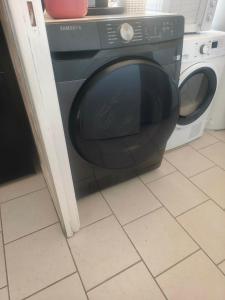 a microwave oven sitting in a kitchen at Emplacement de tente in Hardinghen