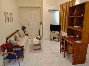 a living room with a couch and a table at Mary's Home in Kalamata