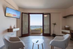 a living room with a view of the ocean at La Rocca di PA in Tropea