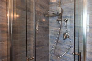 a shower with a hose in a bathroom at La Rocca di PA in Tropea +74 photos