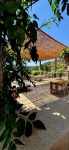 a picnic area with a picnic table and benches at Casa Utopia in Miravet