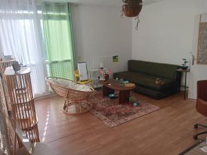 a living room with a couch and a table at Olembe Garden in Avon +22 photos