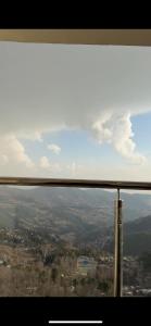 a view of a city from a window at Seven sky hotel in Murree +3 photos