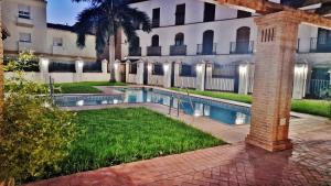 a swimming pool in front of a building at Velez Nazari 2 in Vélez de Benaudalla +11 photos