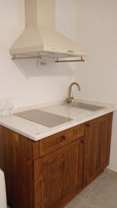a kitchen with a sink and a counter top at La Villeta di Nonna in Selargius +21 photos