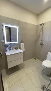 a bathroom with a sink and a toilet and a window at Global properties in Faisalabad +10 photos