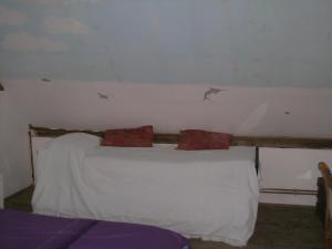 a bedroom with a bed with two sharks on the wall at La Sirène in Saint-Valery-sur-Somme