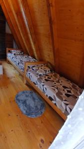 a bedroom with two beds in a attic at Durmitor Holiday in Žabljak +4 photos