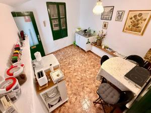 an overhead view of a room with a kitchen and a room at casa rural excentrico alcala in Vélez de Benaudalla