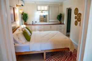 a bedroom with a large bed in a room at Golden View Unit 204 in Saint James +9 photos