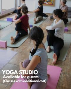 a group of people sitting in a yoga class at Casa Caravan - Plant Based Concept House in Buenos Aires