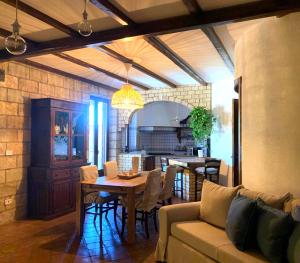 a living room with a couch and a table at Il Giardino del Belvedere in Barrafranca