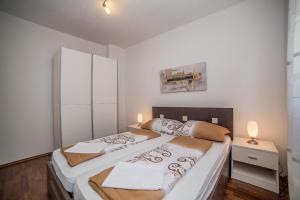Posteľ alebo postele v izbe v ubytovaní Apartments Kati